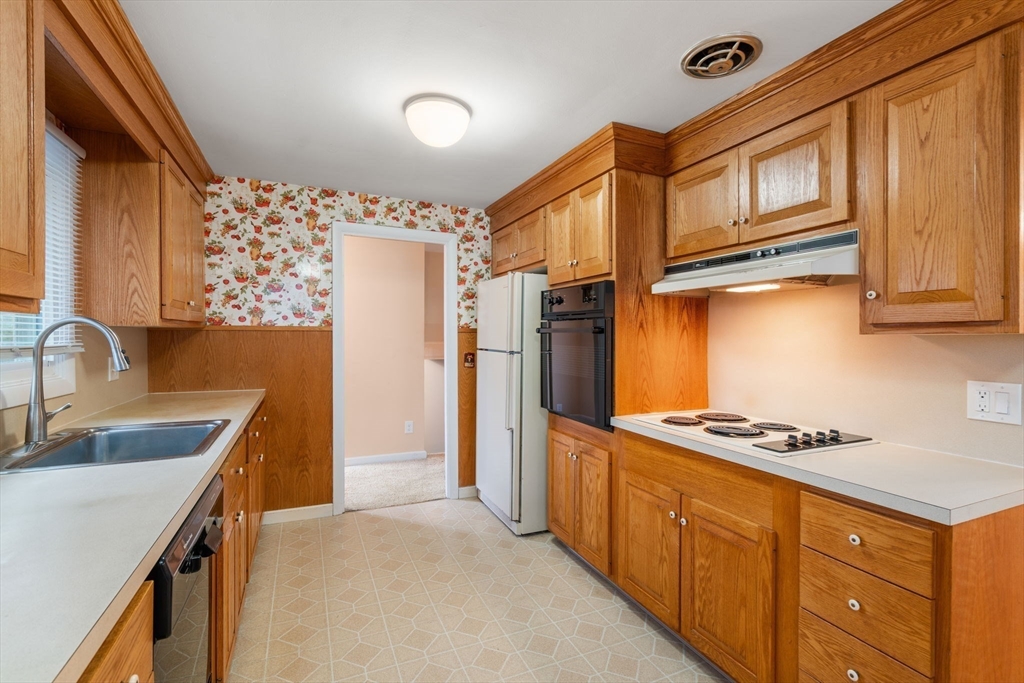 18 Royce Road Framingham, MA 01701 - Photo 9 of 30 a kitchen with stainless steel appliances granite countertop a sink stove and refrigerator