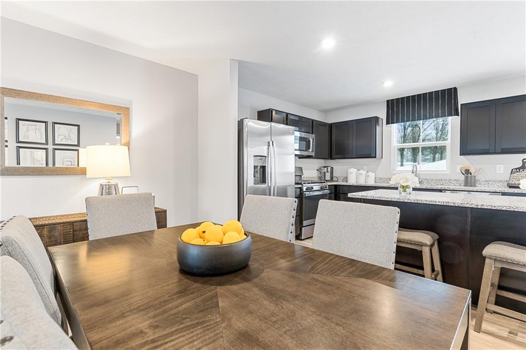 101 Jerome Drive Butler, PA 16001 - Photo 15 of 34 a living room with stainless steel appliances furniture a rug and a window
