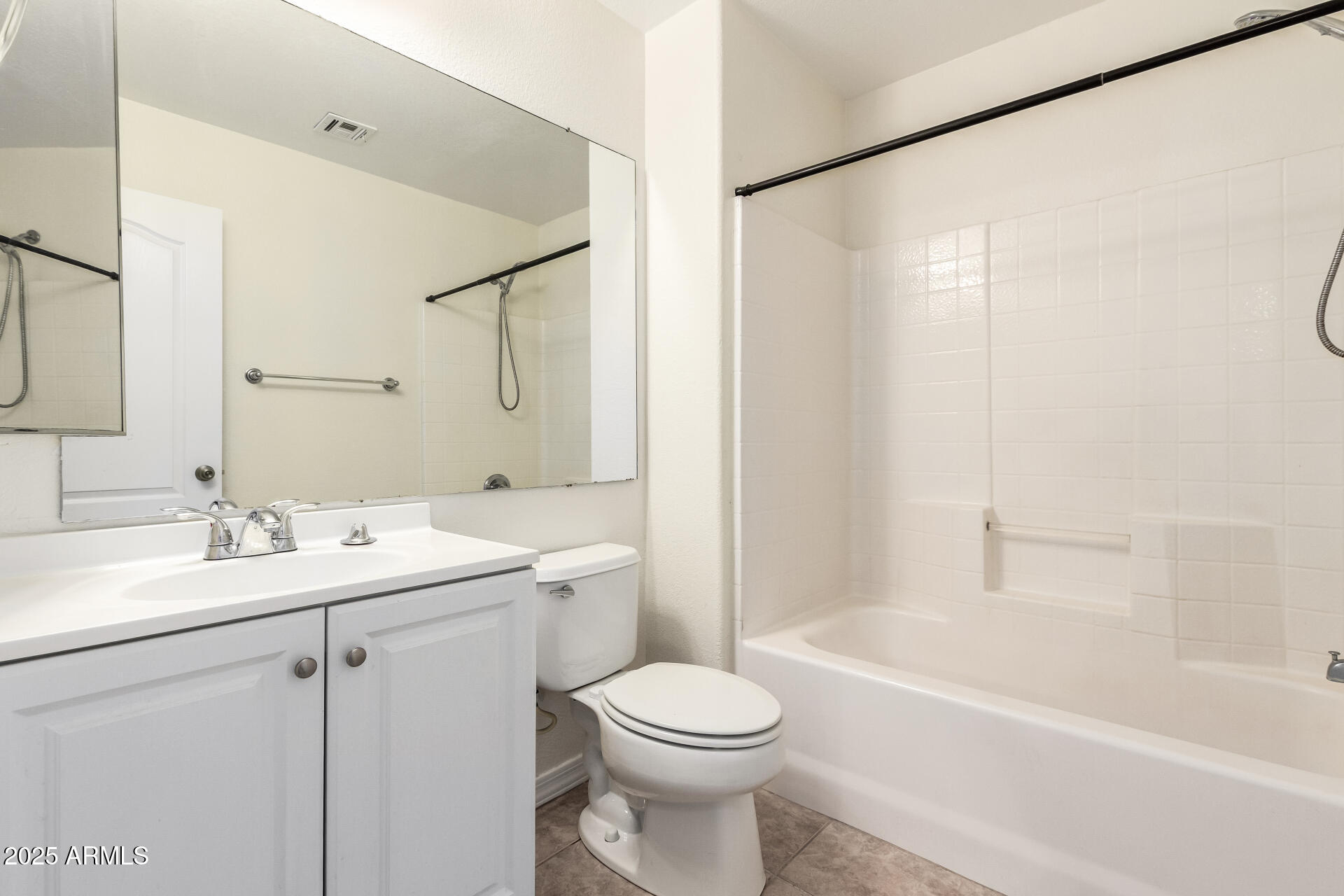 2201 North Comanche Drive, Unit 1104 Chandler, AZ 85224 - Photo 21 of 25 a bathroom with a sink a toilet and shower