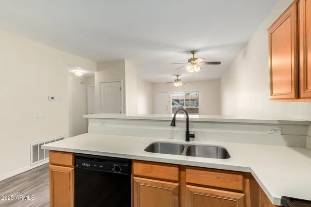 a kitchen with a sink and cabinets