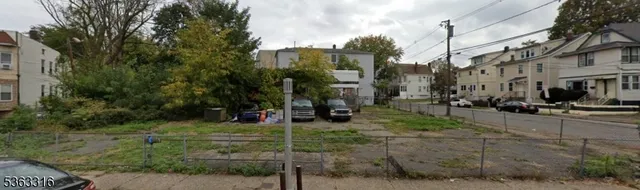 a view of a street with tall buildings