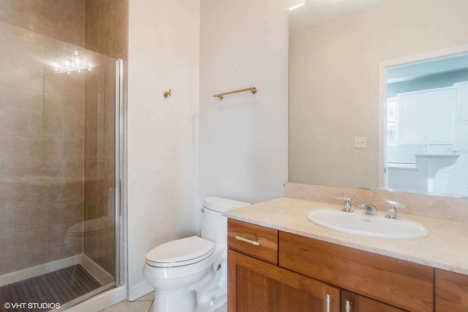 Undisclosed Address Chicago, IL 60642 - Photo 13 of 17 a bathroom with a sink toilet and shower