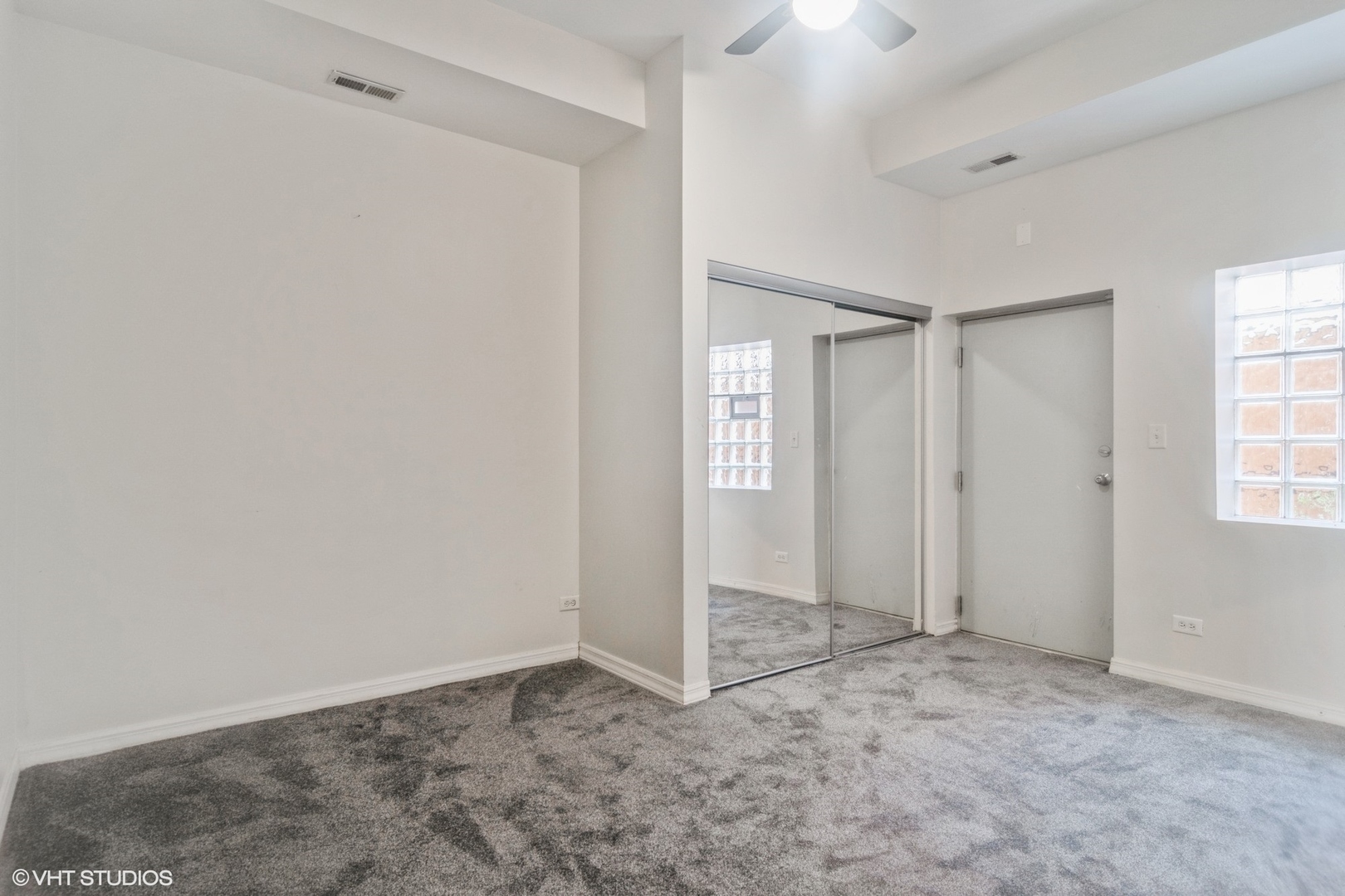 Undisclosed Address Chicago, IL 60642 - Photo 15 of 17 an empty room with windows