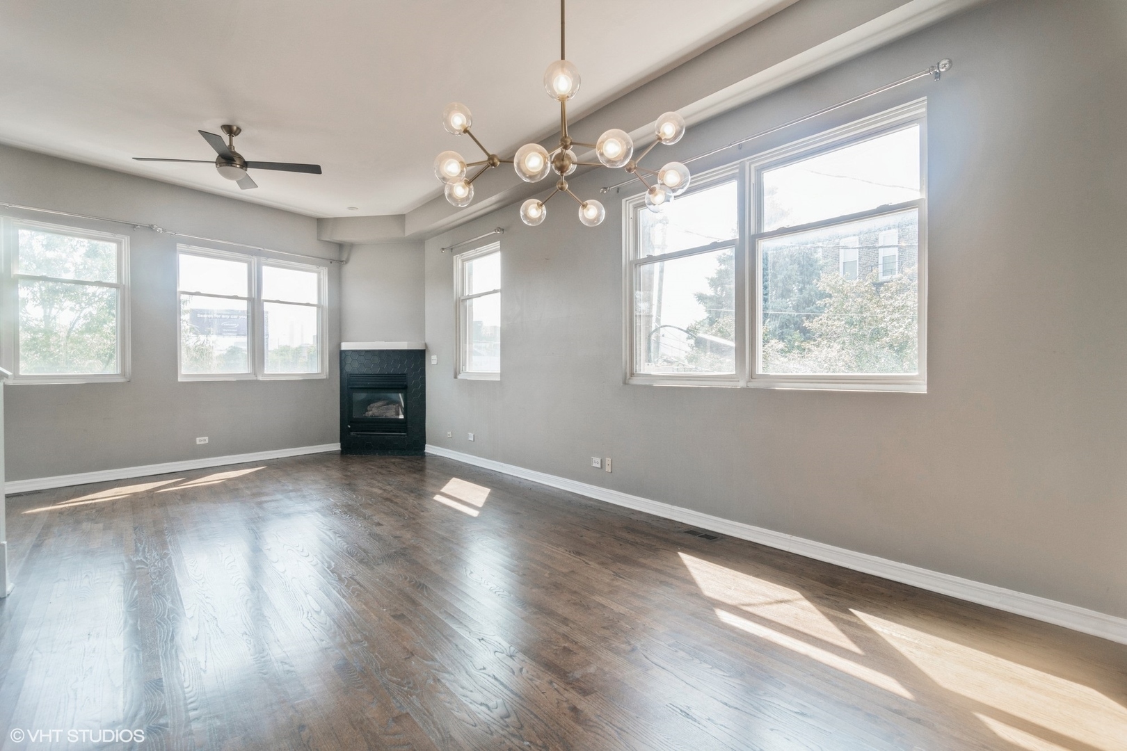 Undisclosed Address Chicago, IL 60642 - Photo 3 of 17 a view of an empty room with wooden floor and a window