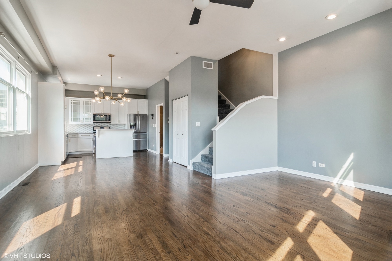 Undisclosed Address Chicago, IL 60642 - Photo 4 of 17 a view of a kitchen with a refrigerator and wooden floor