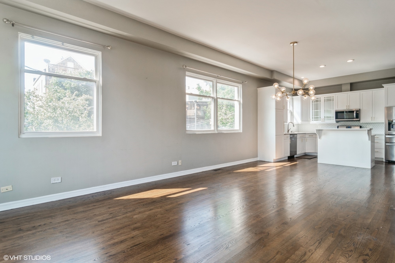 Undisclosed Address Chicago, IL 60642 - Photo 5 of 17 a view of a kitchen with a stove wooden cabinet and a kitchen counter top