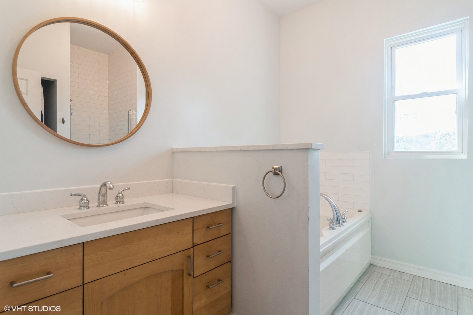 Undisclosed Address Chicago, IL 60642 - Photo 8 of 17 a bathroom with a sink and a mirror