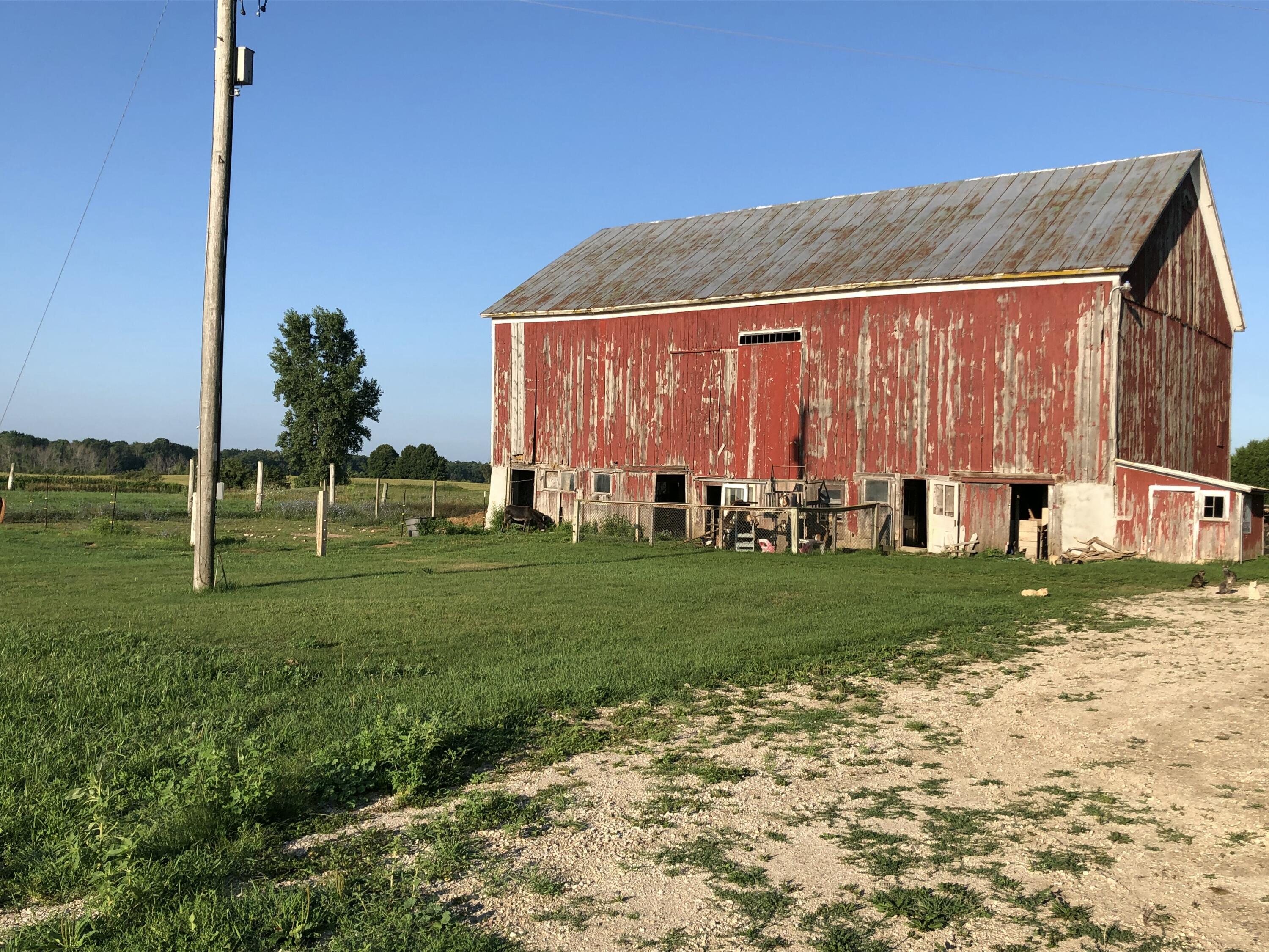2729 County Rd MM Herman, WI 53083 - Photo 36 of 45 East side of the barn, with multiple animal pens established.