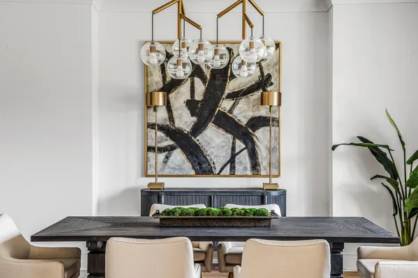 a view of a dining room with furniture and windows