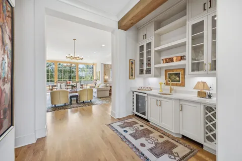 a bathroom with a granite countertop sink and a window