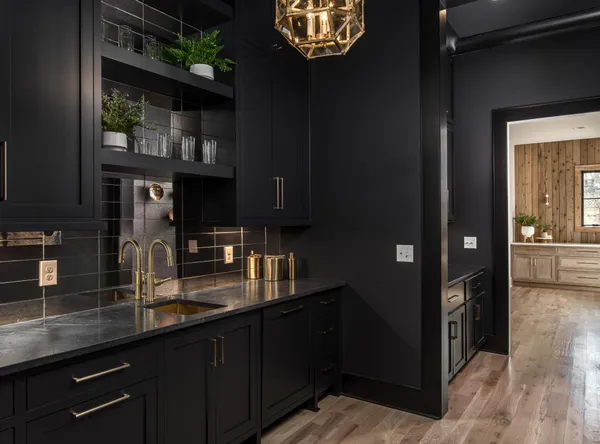a spacious bathroom with a granite countertop sink and a large mirror