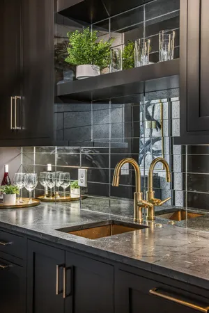a kitchen with stainless steel appliances granite countertop a sink and a stove