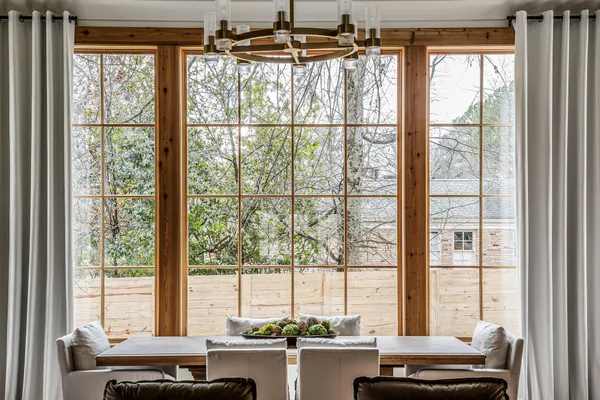 a bedroom with bed and windows