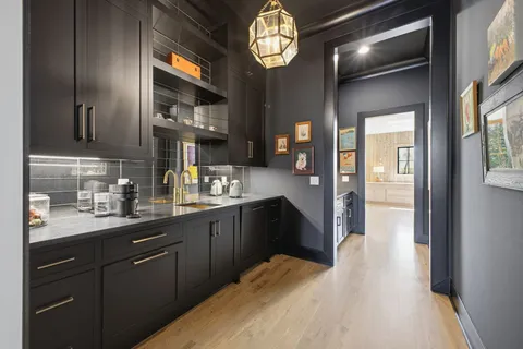 a living room with a bed furniture and a window