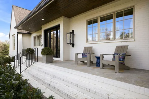 a kitchen with a refrigerator and a stove top oven