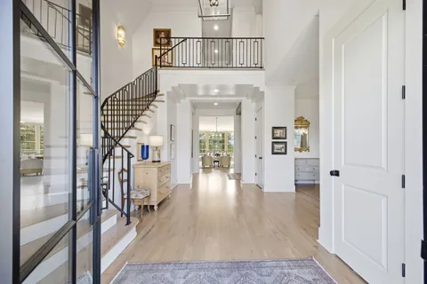 a kitchen with stainless steel appliances a sink a stove and cabinets