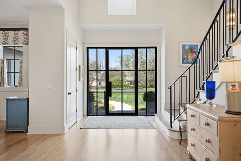 a spacious bathroom with a granite countertop sink mirror and double
