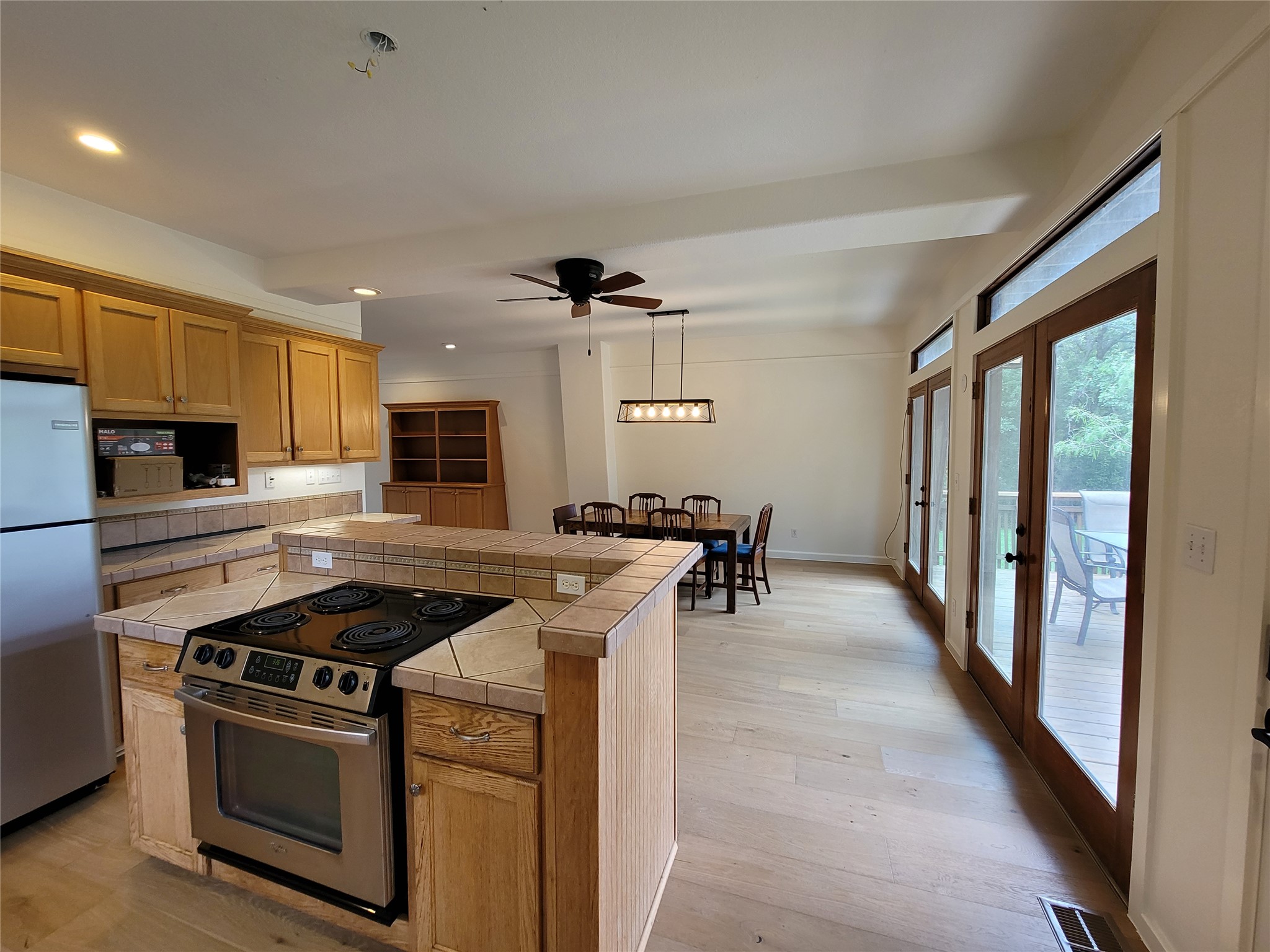 281 Earl Callahan Road, Unit A Cedar Creek, TX 78612 - Photo 15 of 39 a kitchen with stainless steel appliances a stove a sink and a refrigerator