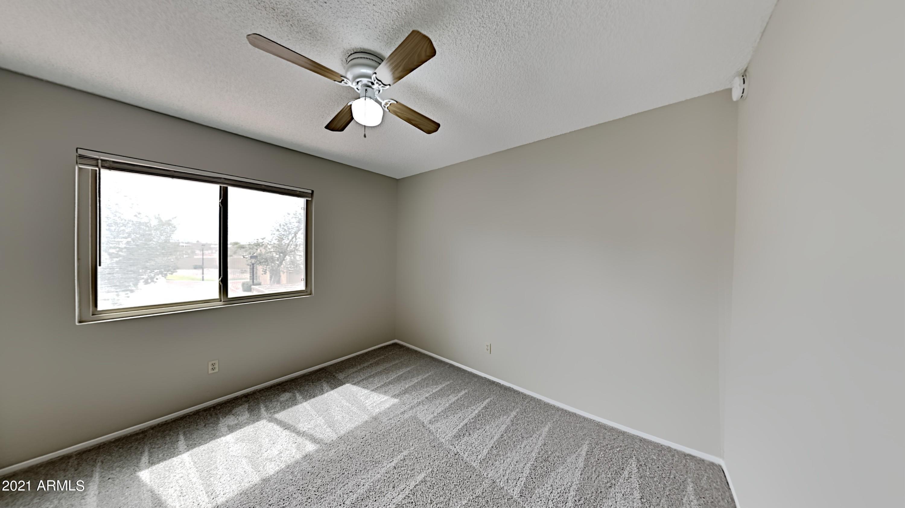 3511 East Baseline Road, Unit 1013 Phoenix, AZ 85042 - Photo 11 of 13 a view of an empty room with a window