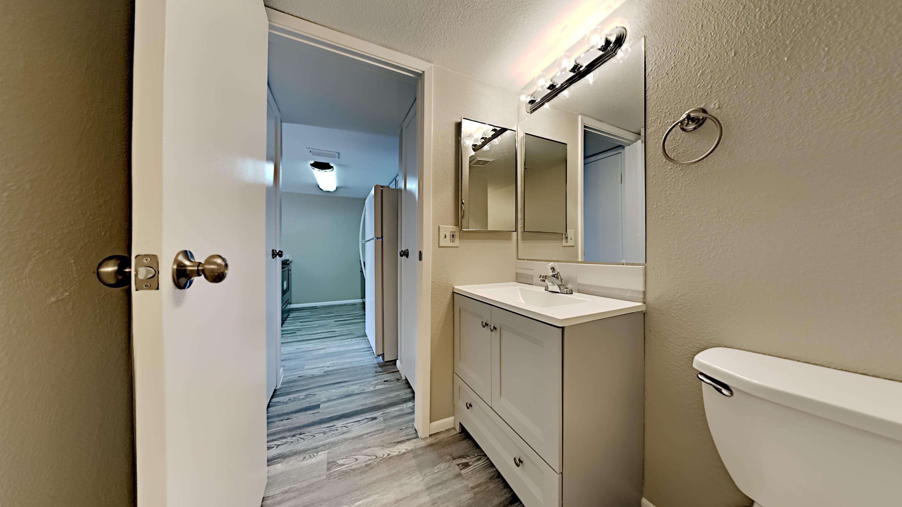 3511 East Baseline Road, Unit 1013 Phoenix, AZ 85042 - Photo 5 of 13 a bathroom with a sink a toilet and shower