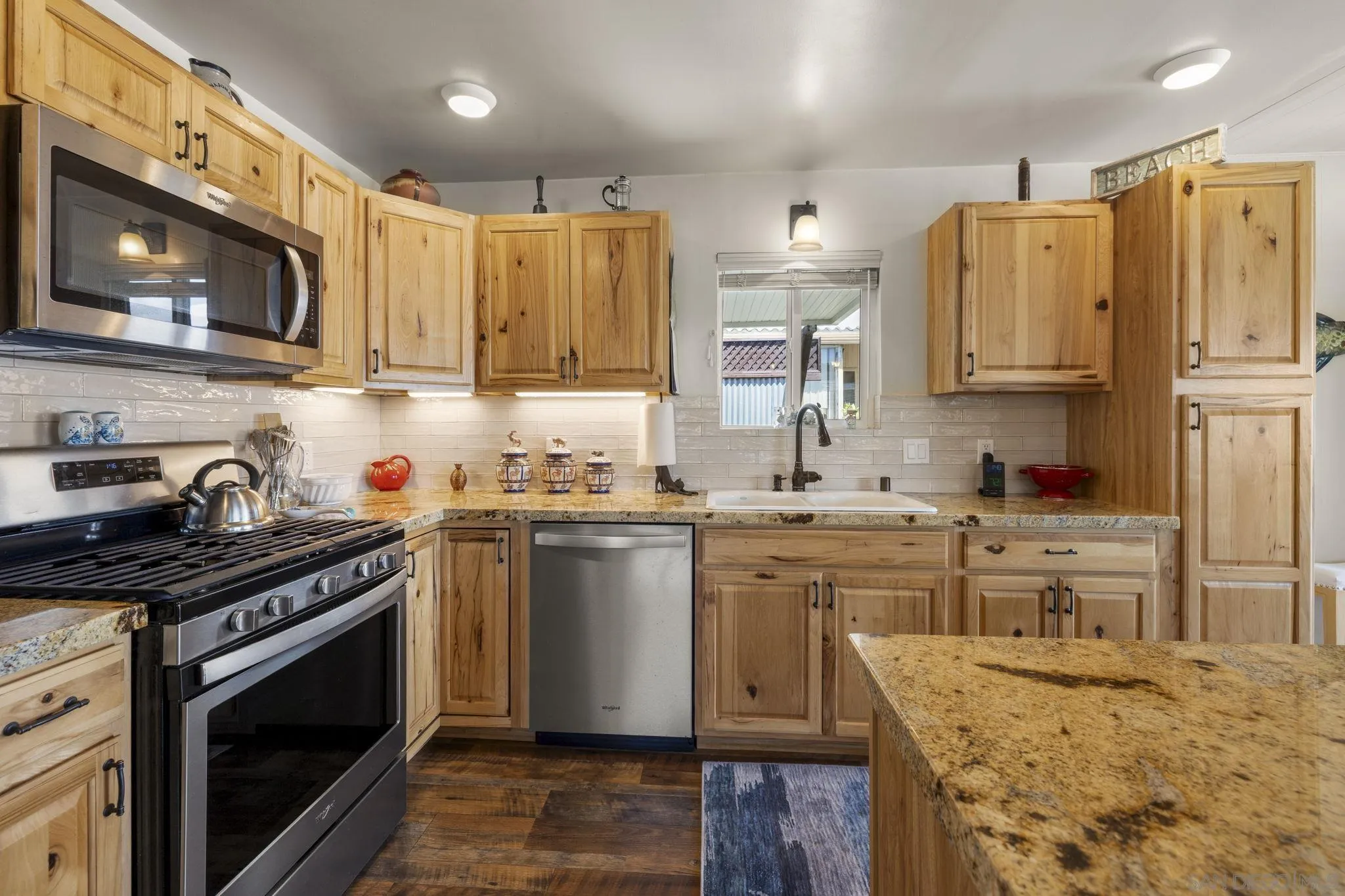 116 Havenview Lane Oceanside, CA 92056 - Photo 1 of 47 a kitchen with stainless steel appliances granite countertop a sink stove refrigerator and cabinets