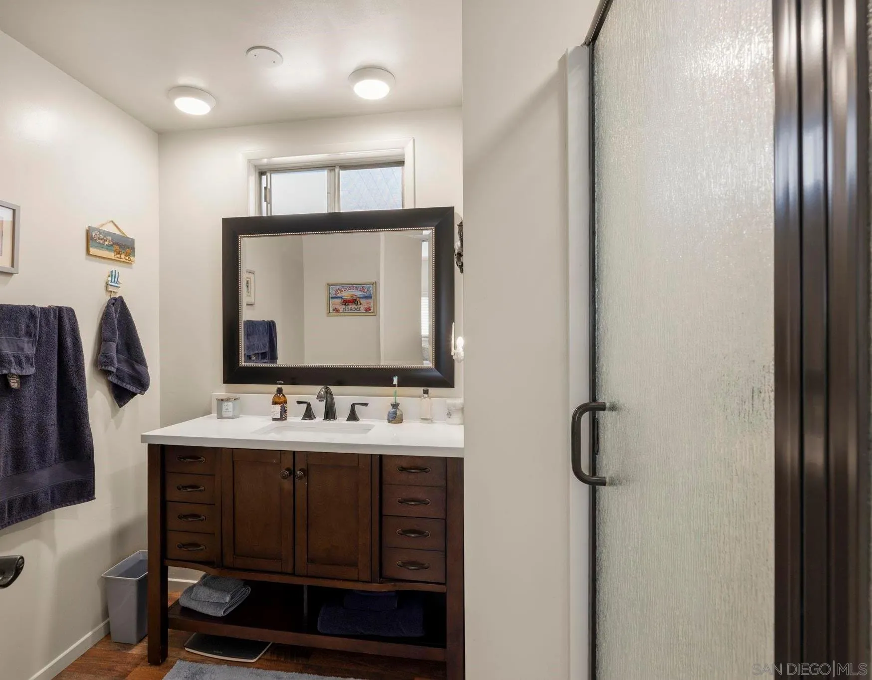 116 Havenview Lane Oceanside, CA 92056 - Photo 17 of 47 a bathroom with a sink toilet and mirror
