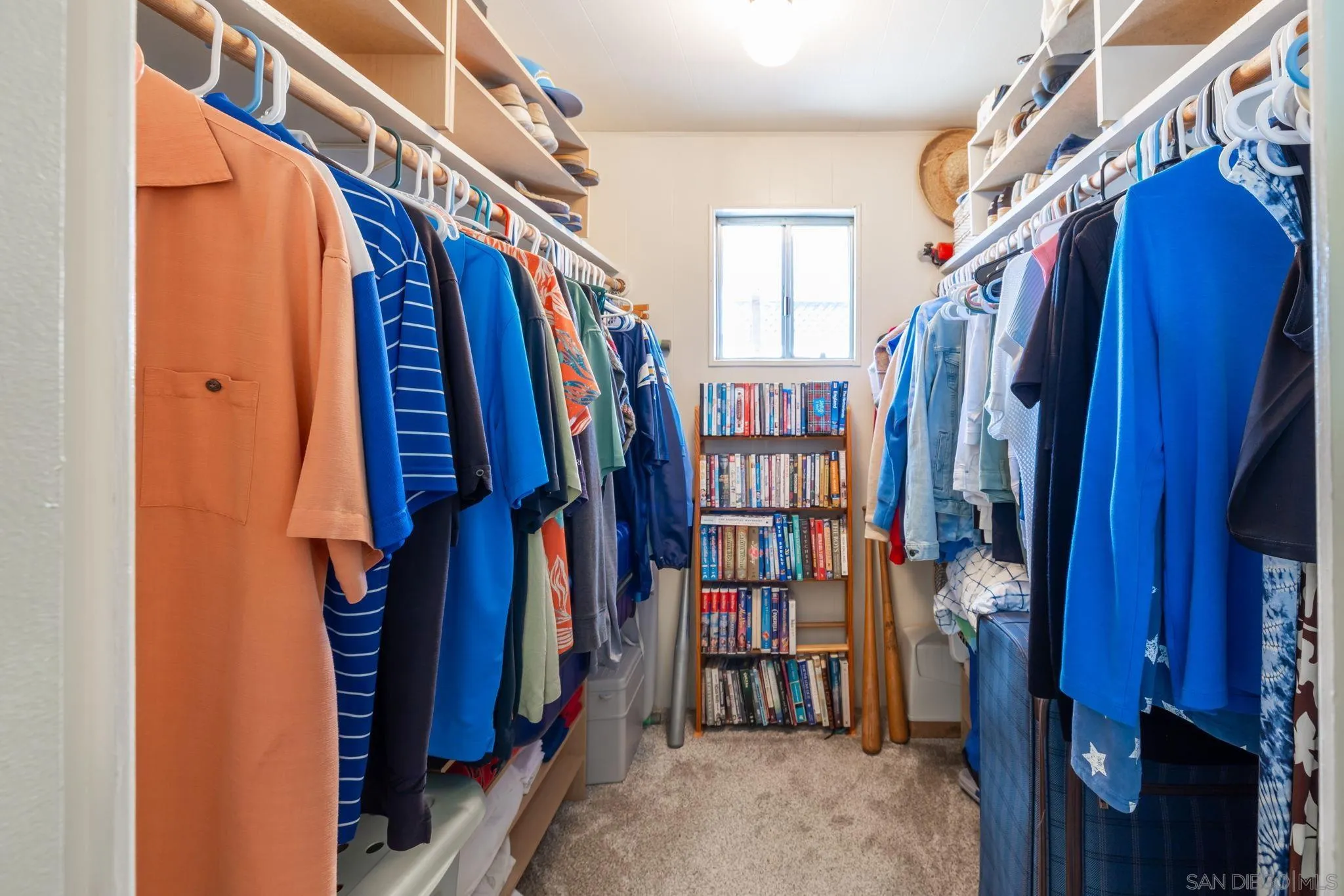 116 Havenview Lane Oceanside, CA 92056 - Photo 18 of 47 a view of walk in closet with clothes and shoes