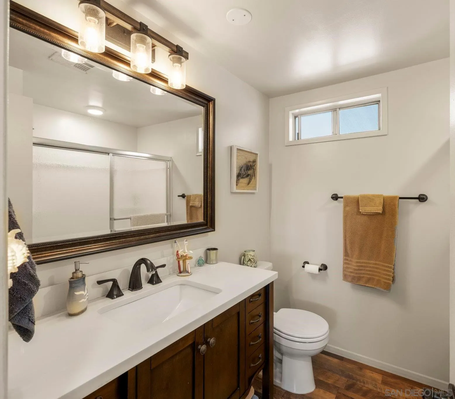 116 Havenview Lane Oceanside, CA 92056 - Photo 20 of 47 a bathroom with a sink toilet and mirror