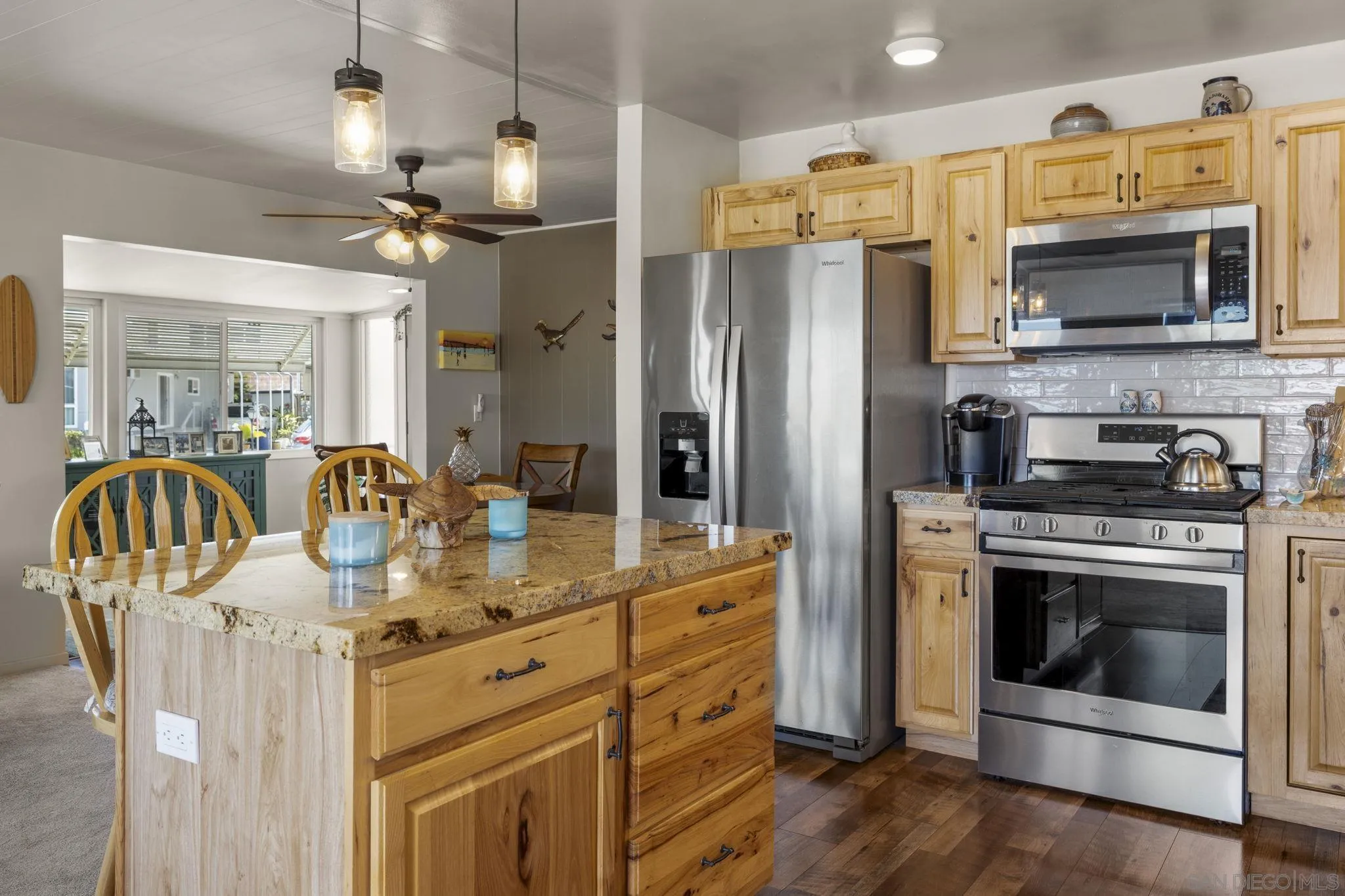 116 Havenview Lane Oceanside, CA 92056 - Photo 4 of 47 a kitchen with stainless steel appliances granite countertop a stove a refrigerator and a microwave