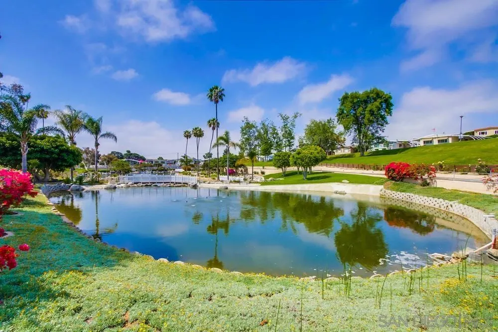 116 Havenview Lane Oceanside, CA 92056 - Photo 41 of 47 a view of a lake with a house in the background