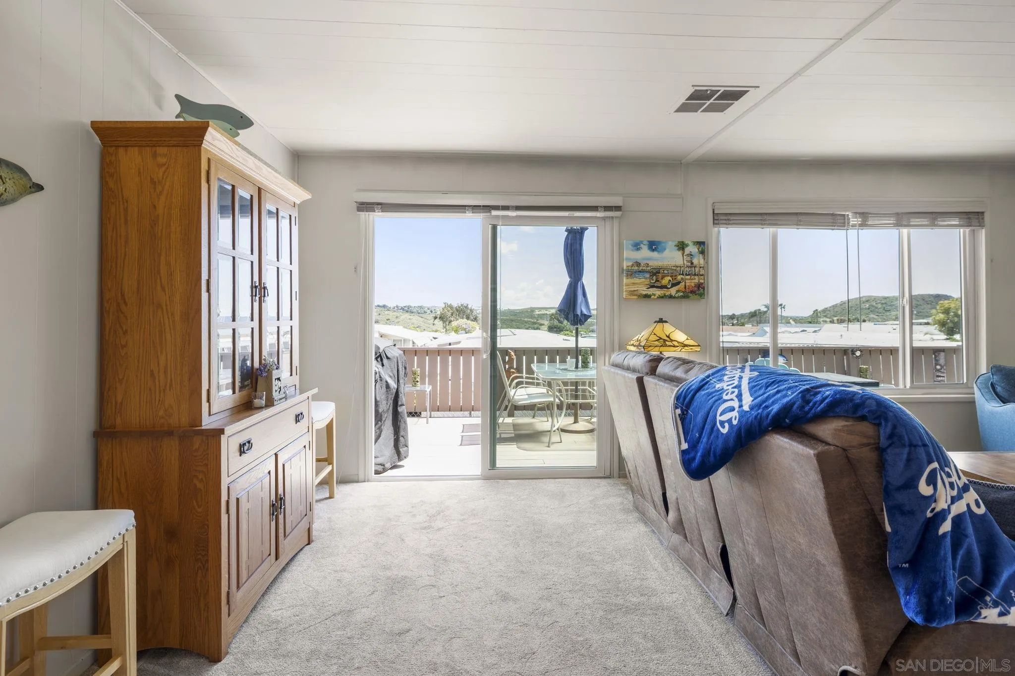 116 Havenview Lane Oceanside, CA 92056 - Photo 10 of 47 a living room with furniture and a floor to ceiling window