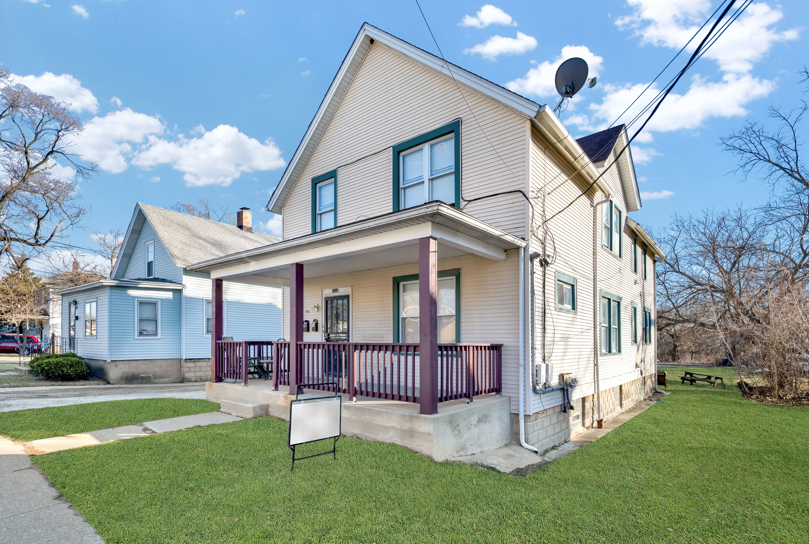 a view of a house with a yard and garden