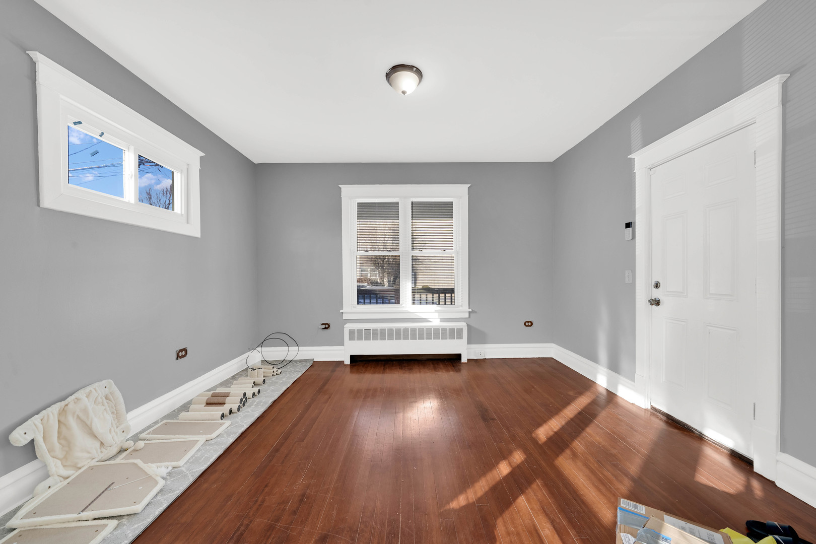 1915 Vermont Street Blue Island, IL 60406 - Photo 3 of 24 a view of a room with wooden floor and window