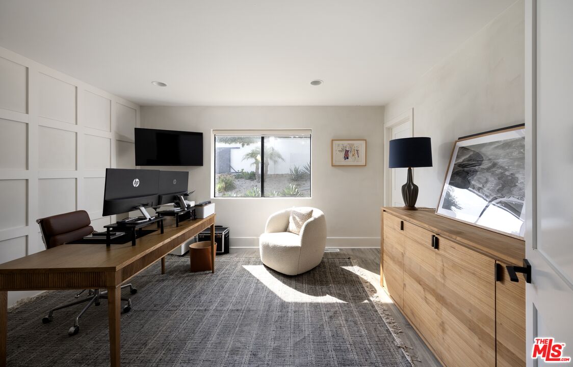 29328 Heathercliff Road Malibu, CA 90265 - Photo 29 of 46 a living room with furniture and a flat screen tv