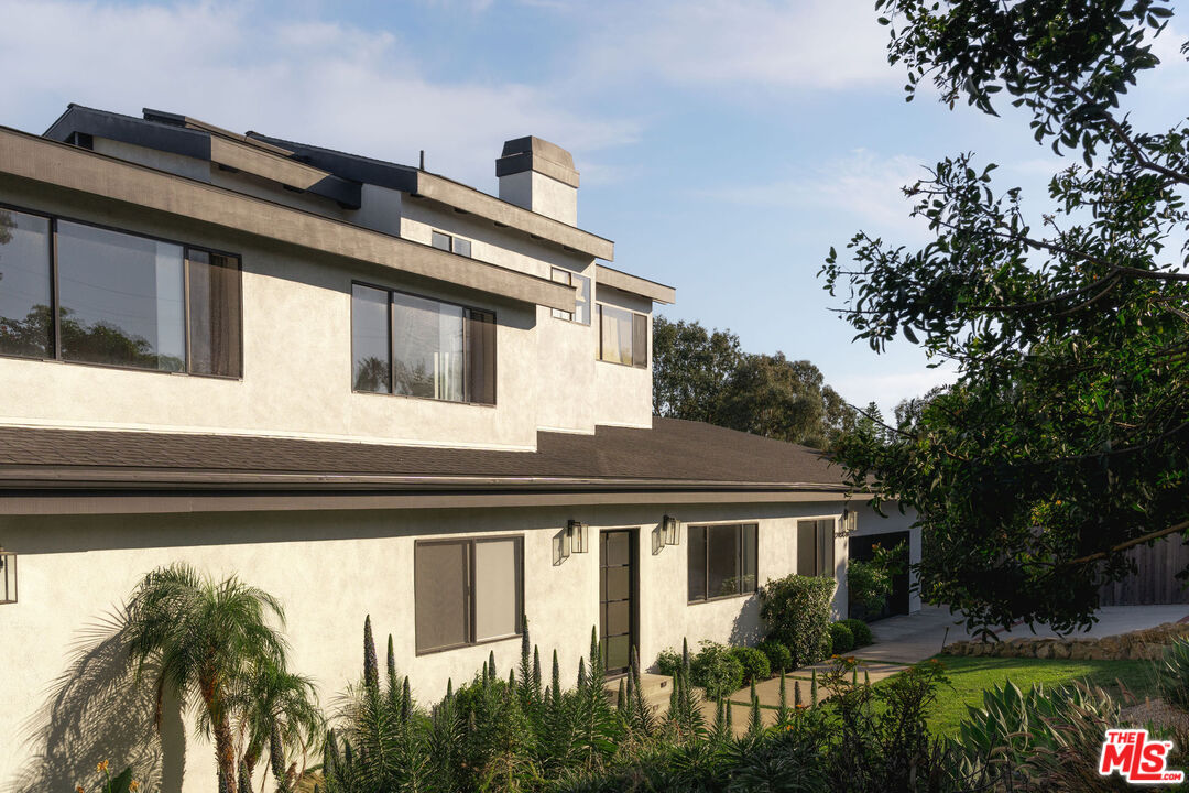 29328 Heathercliff Road Malibu, CA 90265 - Photo 3 of 46 a front view of house with yard and green space