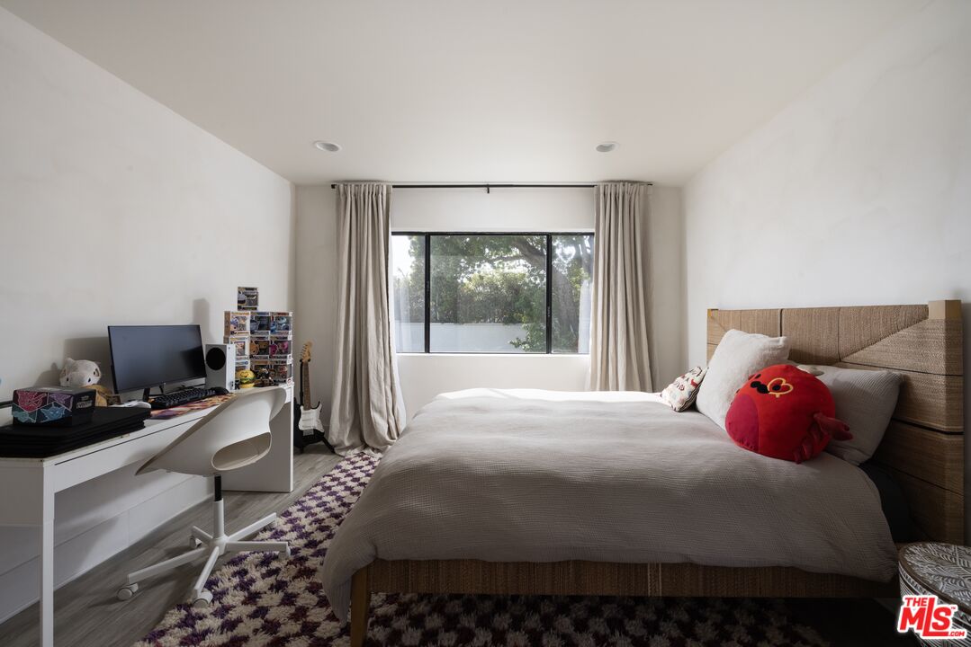 29328 Heathercliff Road Malibu, CA 90265 - Photo 31 of 46 a bedroom with a bed and a window