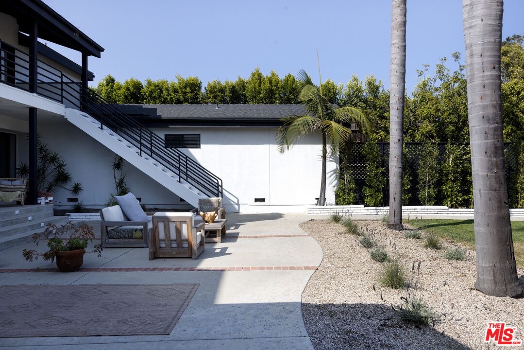 29328 Heathercliff Road Malibu, CA 90265 - Photo 35 of 46 a view of a house with backyard porch and sitting area