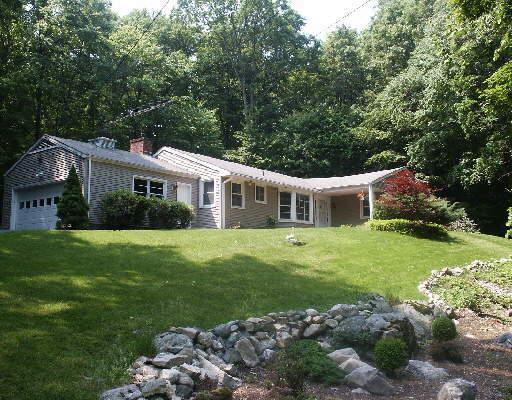 330 Red Fox Road Stamford, CT 06903 - Photo 1 of 1 a front view of a house with a garden