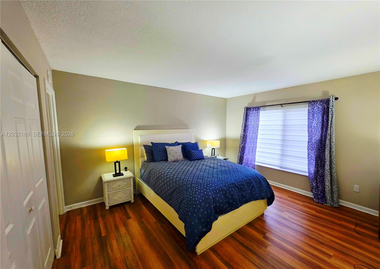 4164 Inverrary Drive, Unit 204 Lauderhill, FL 33319 - Photo 16 of 28 a bedroom with a bed and a window