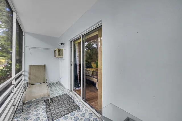 a living room with a couch and a rug