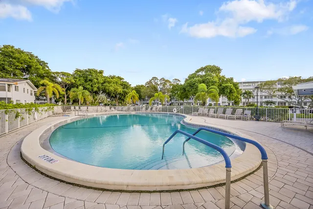 a view of a swimming pool with a terrace