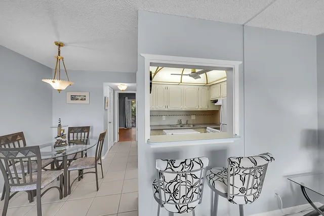 a room with a table and chairs