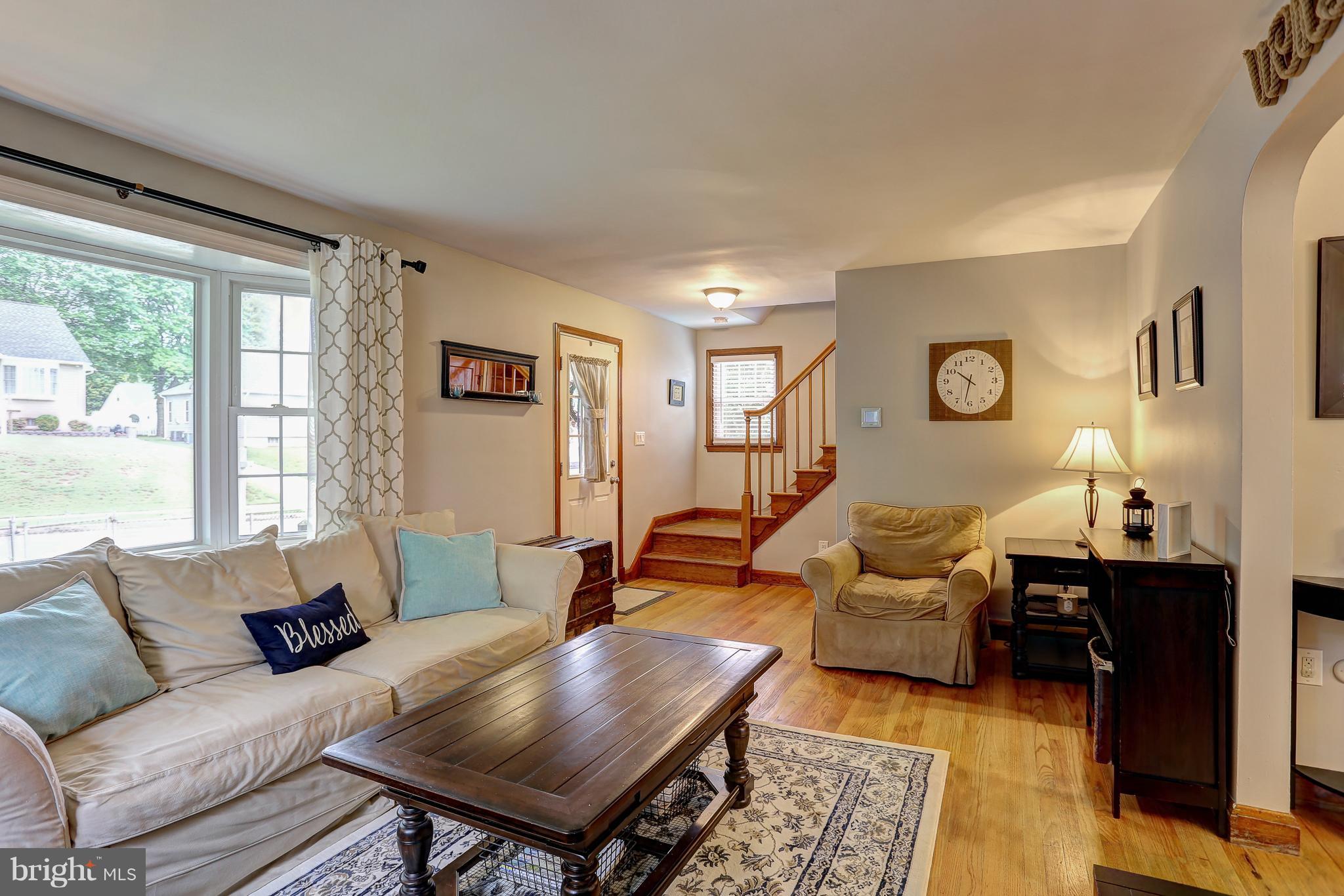 5537 Gayland Road Baltimore, MD 21227 - Photo 3 of 20 a living room with furniture and wooden floor