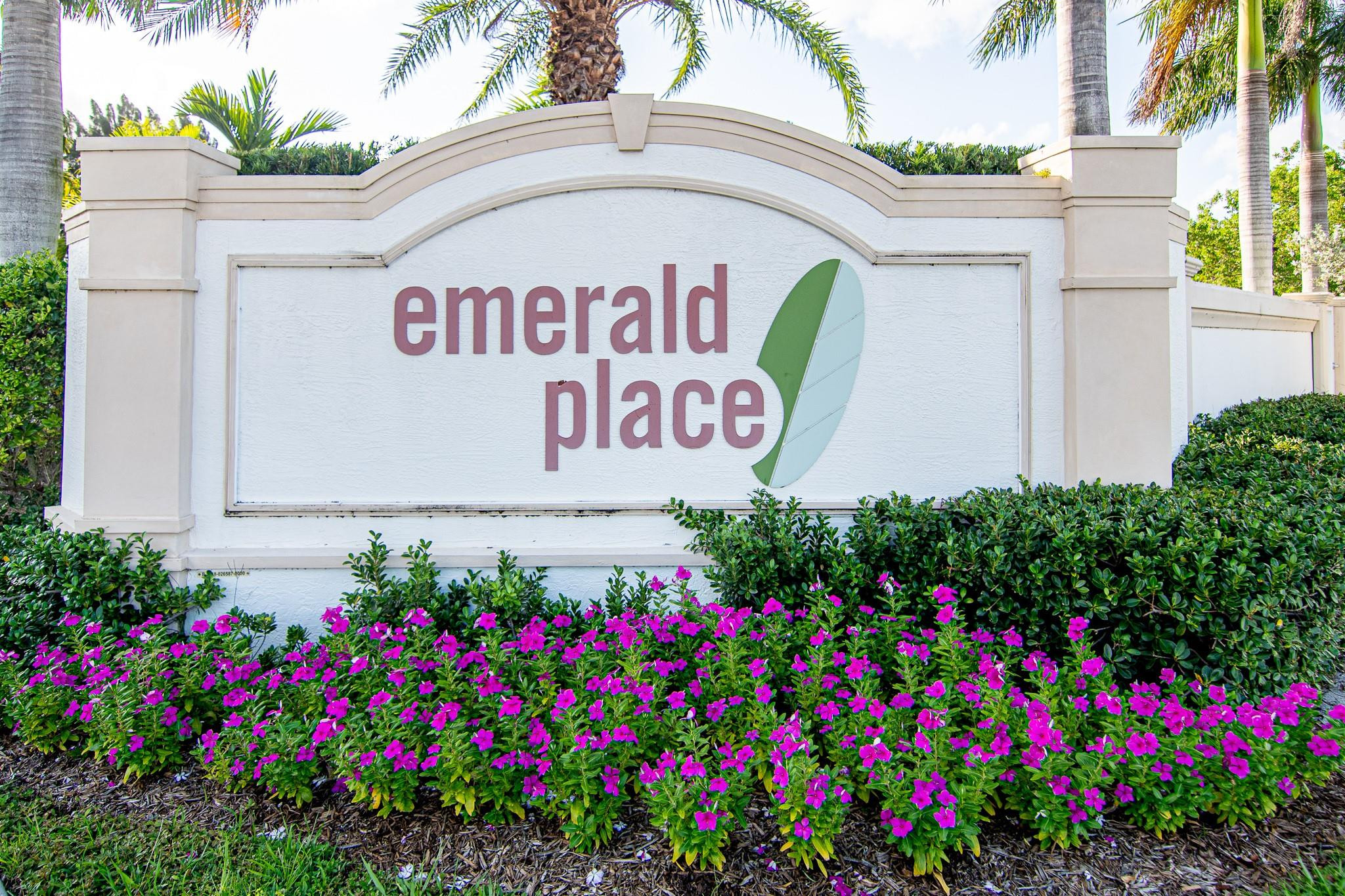 14377 Sims Road, Unit 14390 Delray Beach, FL 33484 - Photo 2 of 13 a sign that is in front of flowers