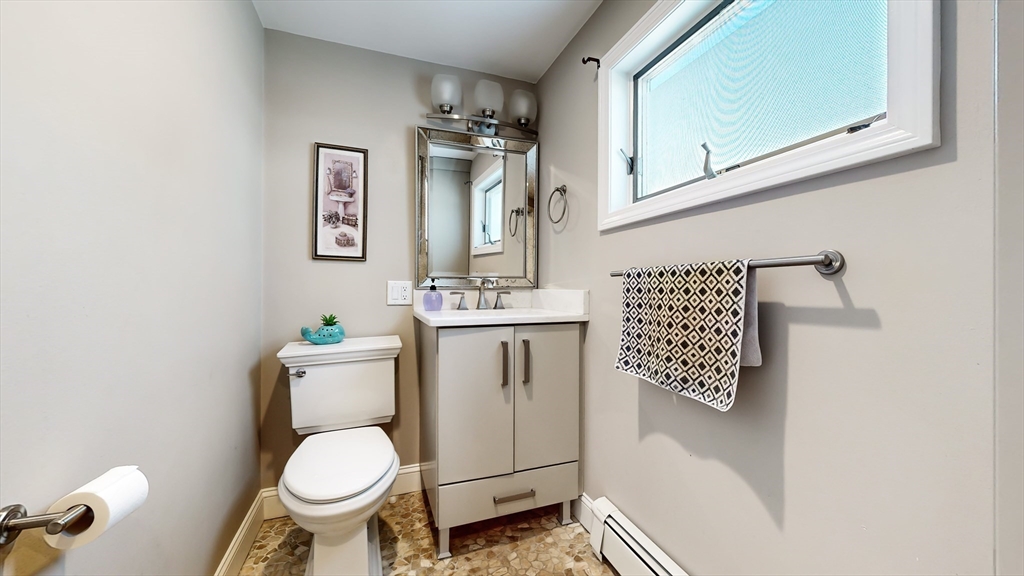 11 Atlantic Avenue Saugus, MA 01906 - Photo 12 of 22 a bathroom with a toilet sink and mirror