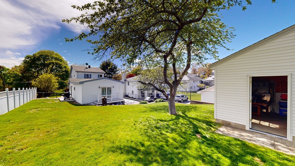 11 Atlantic Avenue Saugus, MA 01906 - Photo 17 of 22 a view of a house with a yard and large tree