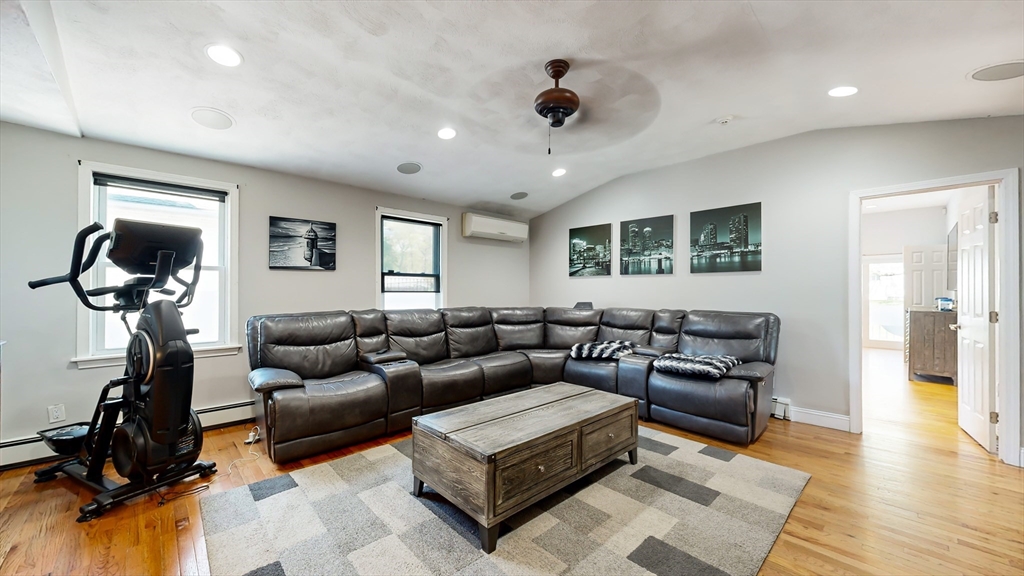 11 Atlantic Avenue Saugus, MA 01906 - Photo 2 of 22 a living room with furniture and a flat screen tv