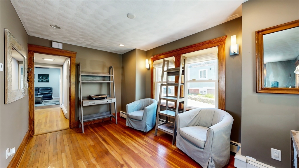 11 Atlantic Avenue Saugus, MA 01906 - Photo 3 of 22 a living room with furniture and a wooden floor