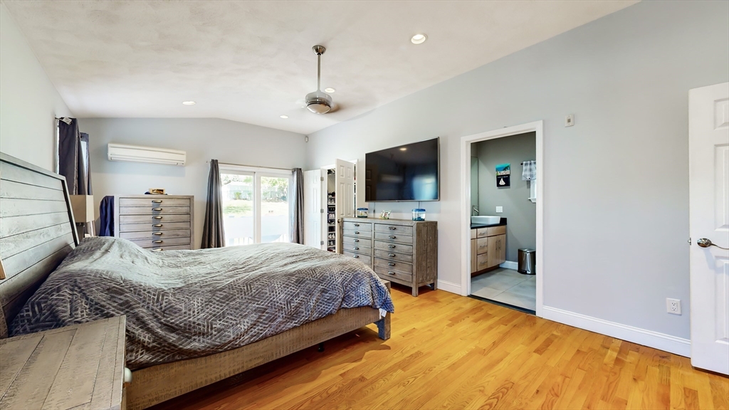 11 Atlantic Avenue Saugus, MA 01906 - Photo 7 of 22 a bedroom with a bed and a flat screen tv