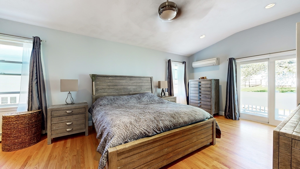 11 Atlantic Avenue Saugus, MA 01906 - Photo 8 of 22 a bedroom with a bed and wooden floor